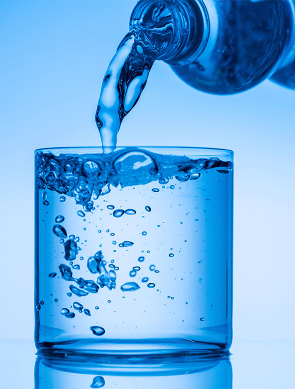 Pouring Clean Water in a Glass